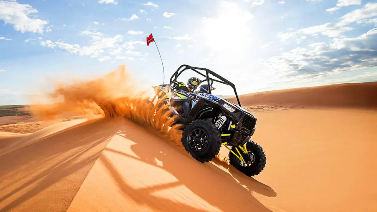 Dune buggy cresting a sand dune in the Merzouga desert