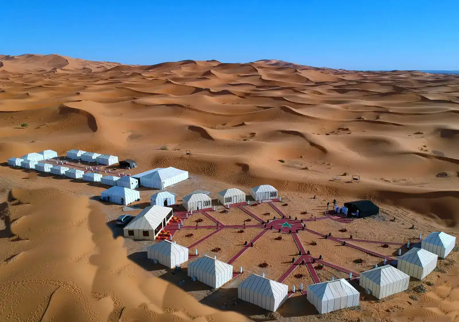 Aerial view of Merzouga Glamping beside the Erg Chebbi dunes