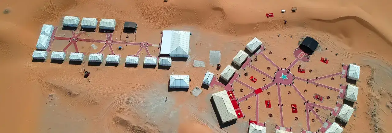 Drone panorama of the Merzouga Glamping camp beside the Erg Chebbi dunes