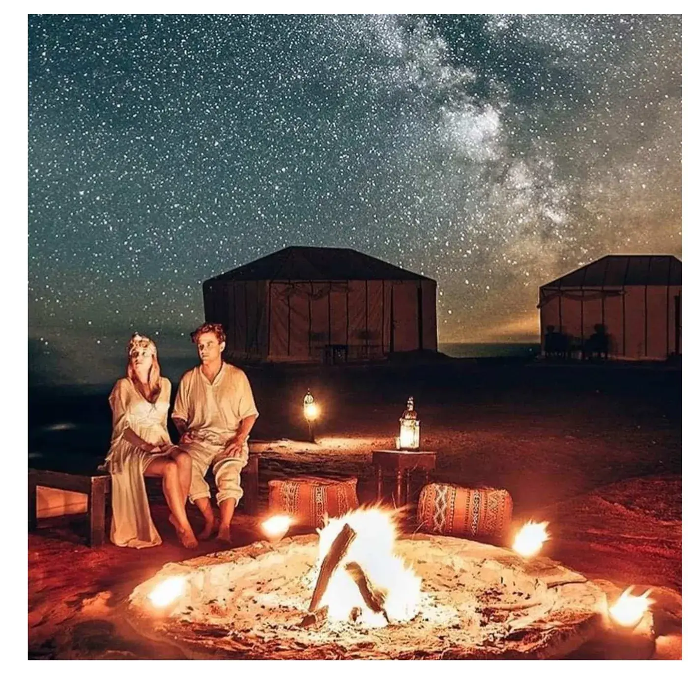 Dinner served outdoors at sunset at the Merzouga Glamping desert camp