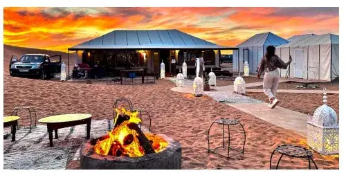 Private dinner setup in the Merzouga desert for a celebration or marriage plan