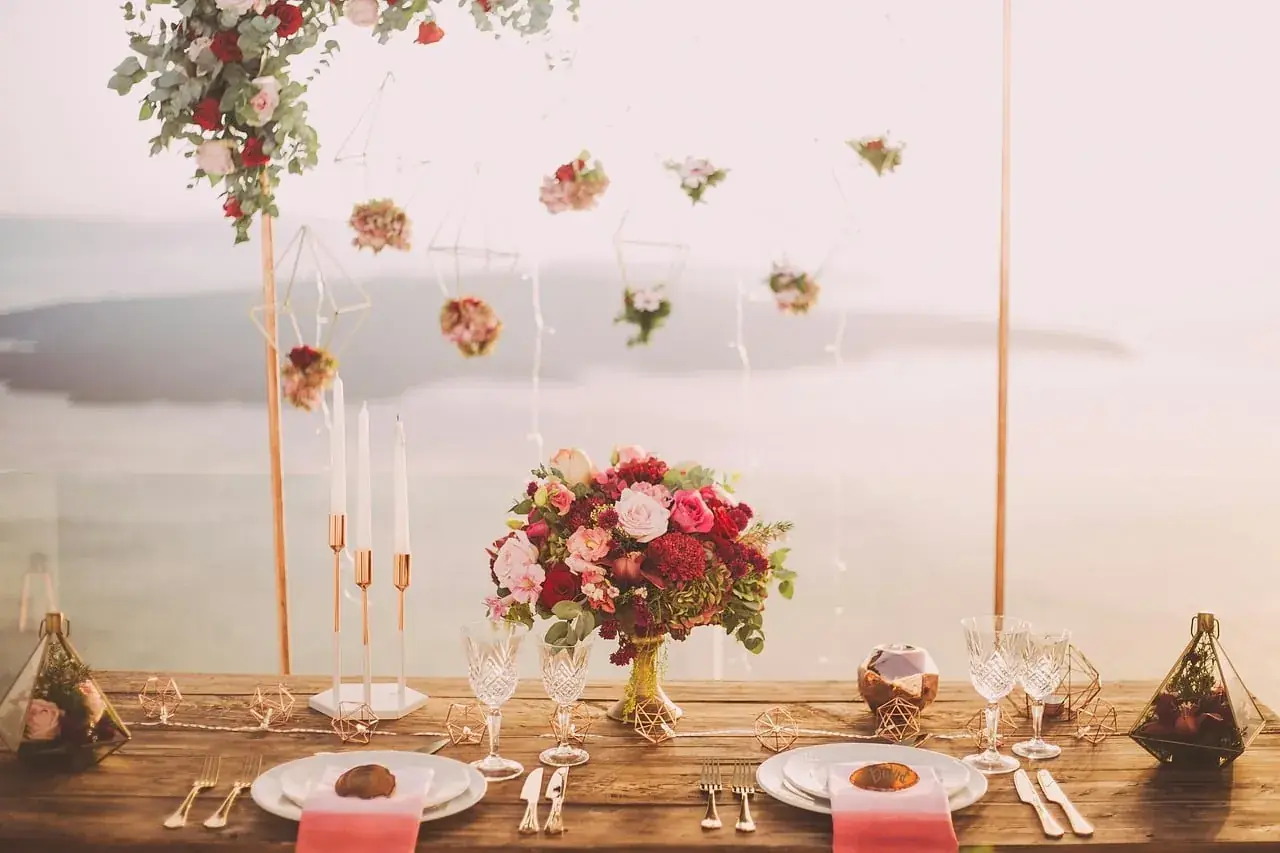 Celebration table dressed with flowers and candles