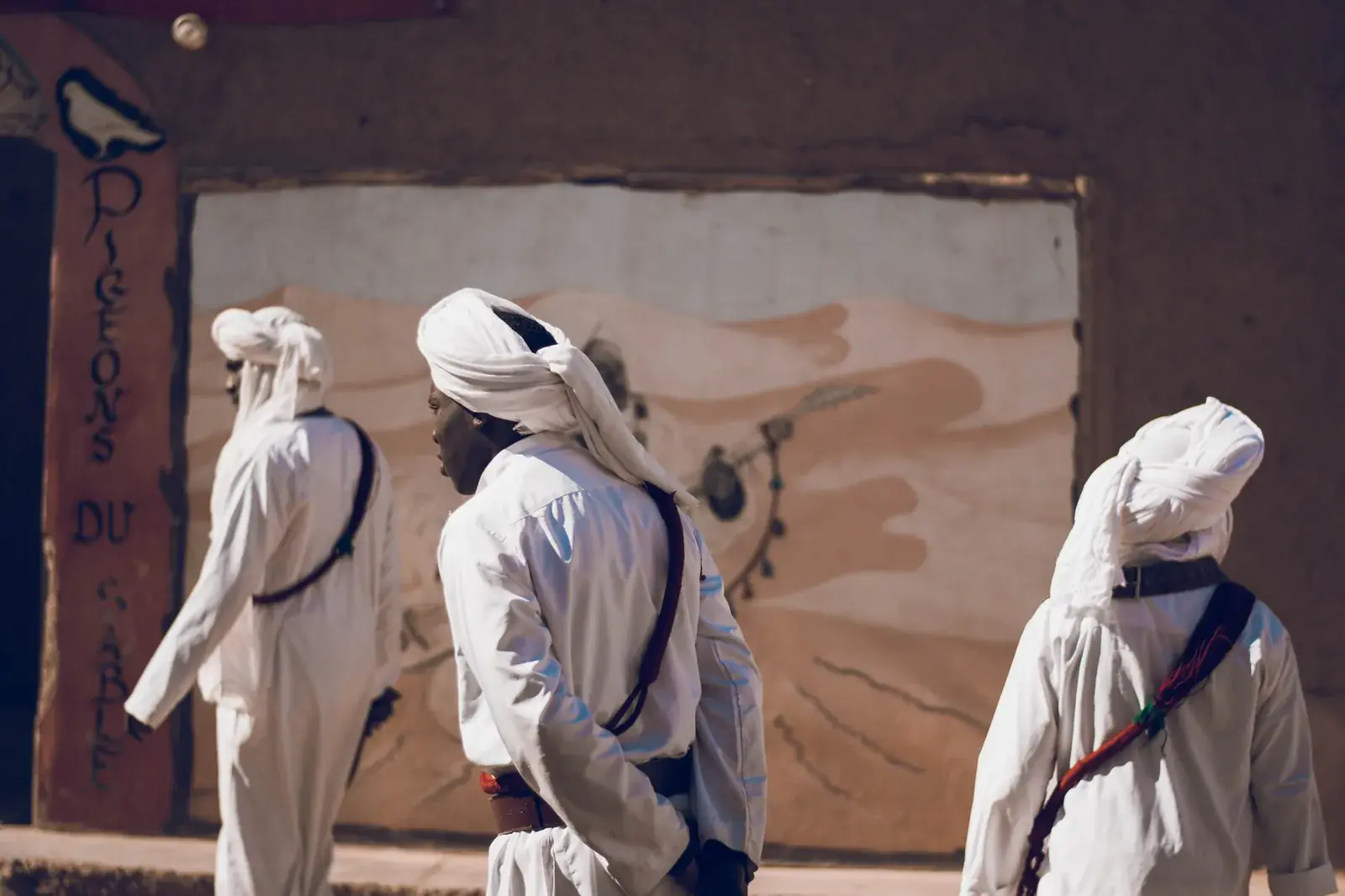 Members of the Khamlia Gnawa band in white djellabas