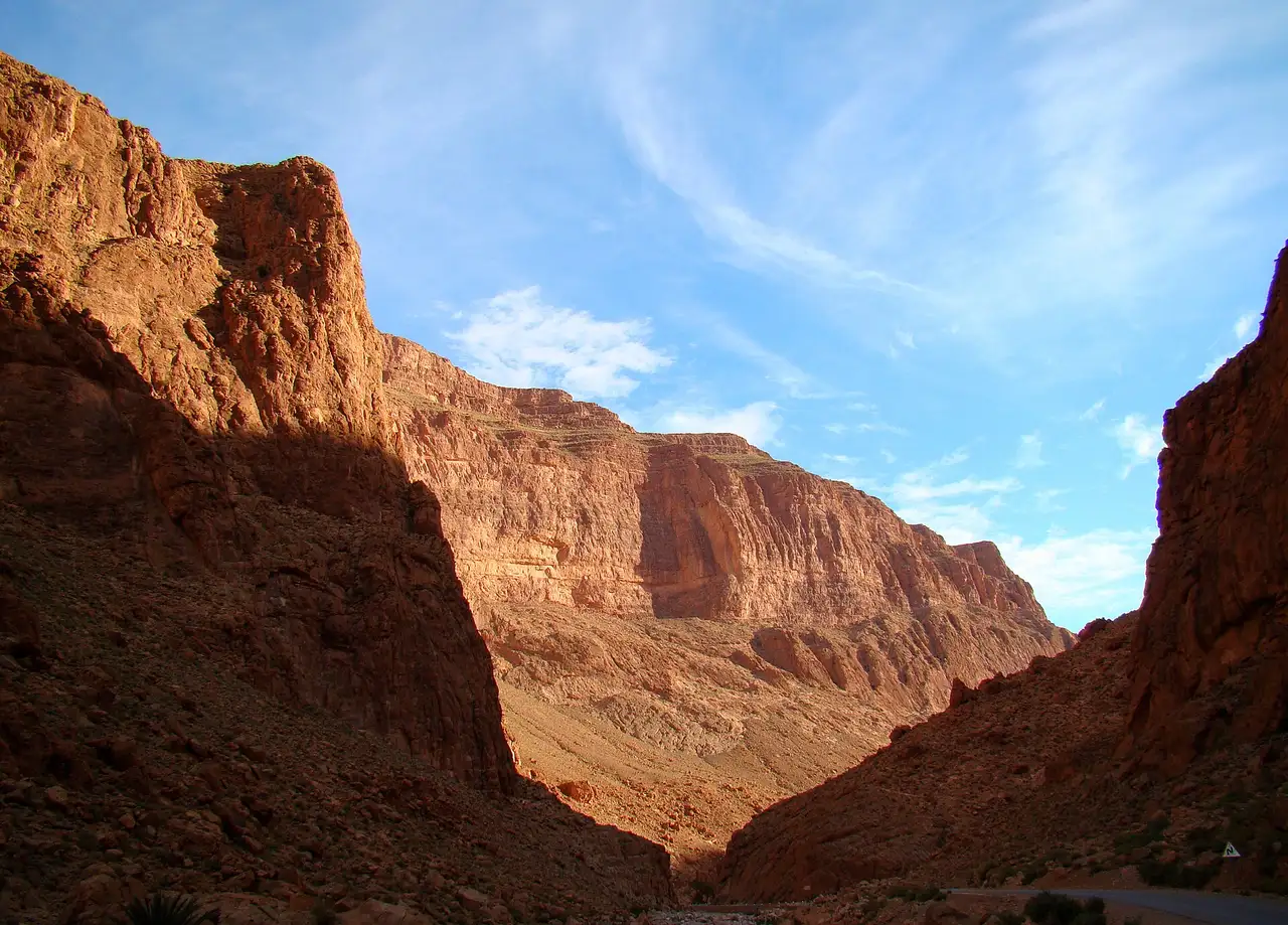 Morning light on the tall red cliffs of the Todra Gorge
